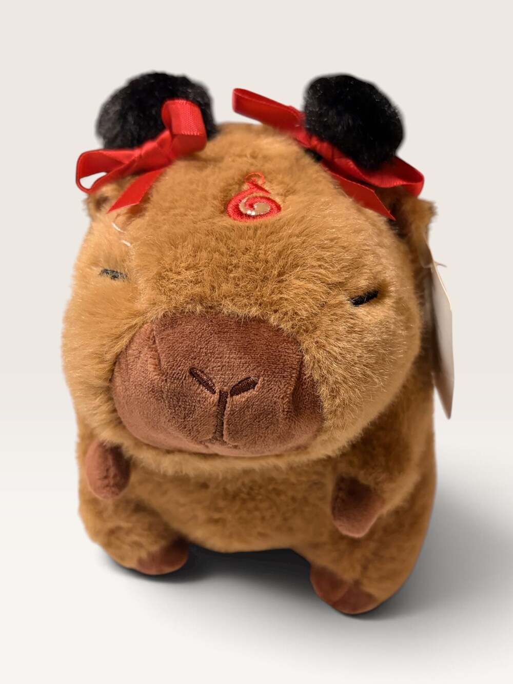 Capybara Plush Toy with Red Ribbons and Black Ears